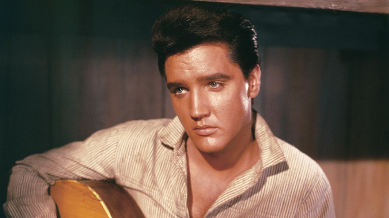 Young Elvis Presley staring