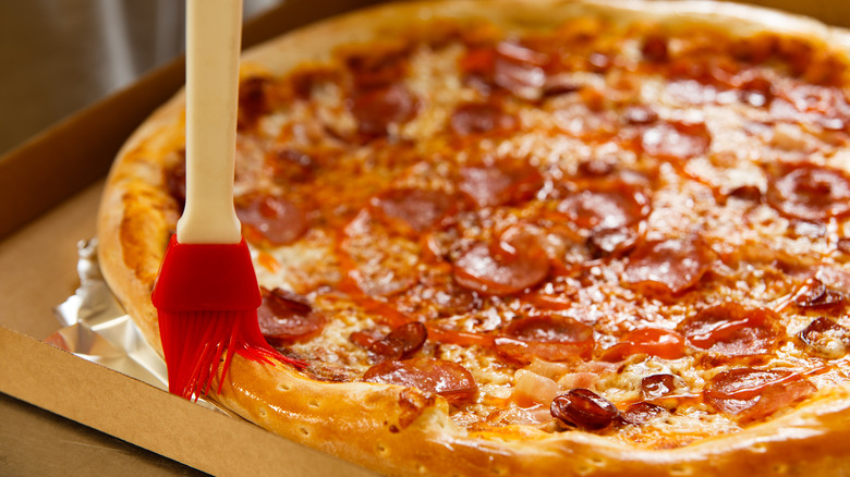 Pizza crust brushed with oil