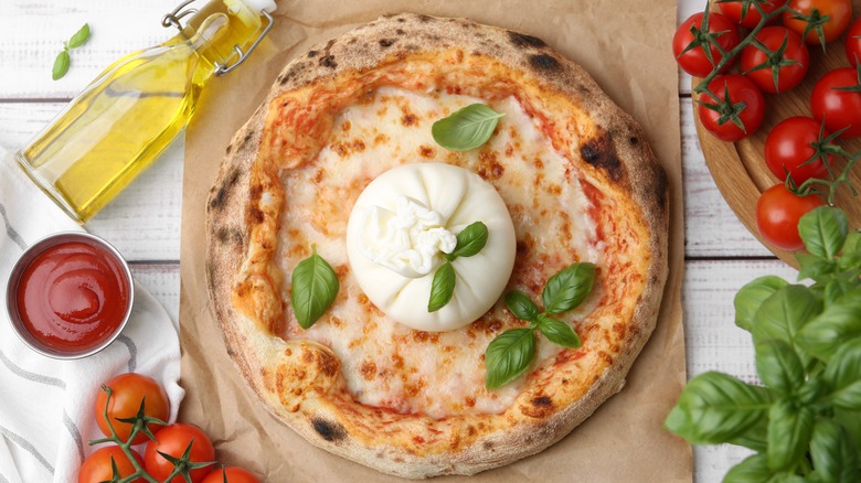Overhead view of pizza with burrata