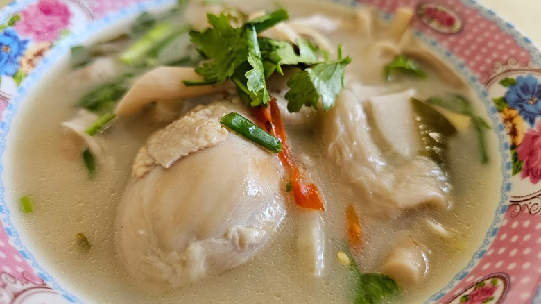 A bowl of Tom Kha Gai or Thai chicken coconut soup