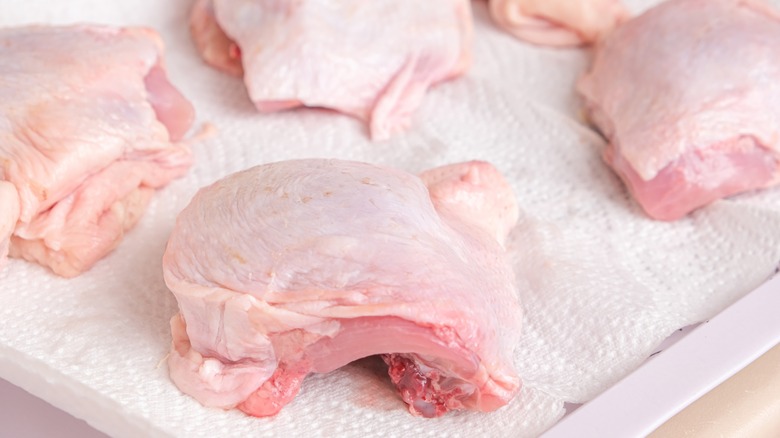 Chicken thighs on a paper towel