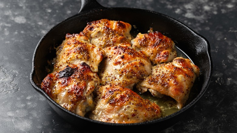 Chicken thighs in a skillet