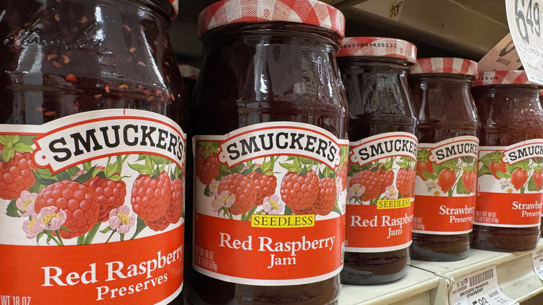 Jars of Smucker's jams displayed on a store shelf