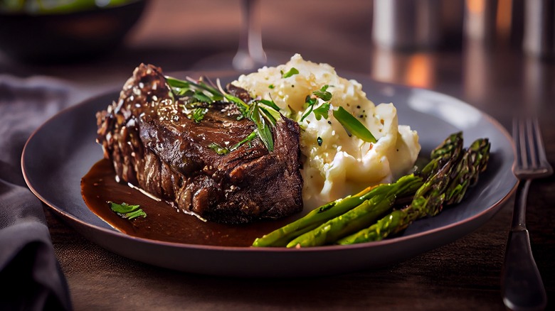 Rib eye steak with mashed potatoes and asparagus