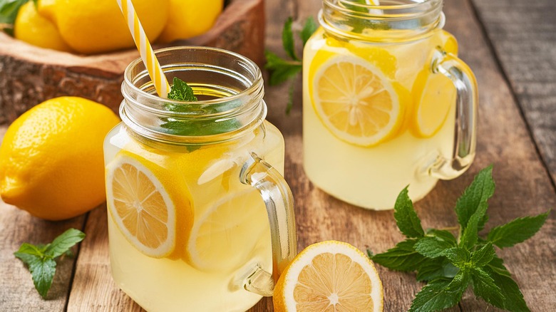 Homemade lemonade with lemon and mint in mason jars
