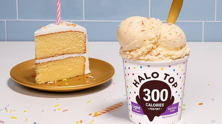 Pint of Halo Top Birthday Cake ice cream next to slice of cake