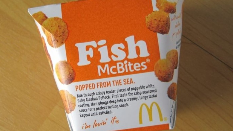 A box of McDonald's Fish McBites on a wooden table