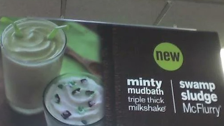 A sign advertising McDonald's Swamp Sludge McFlurry and Minty Mudbath milkshake