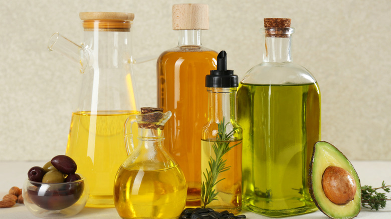 A range of cooking oils in glass containers