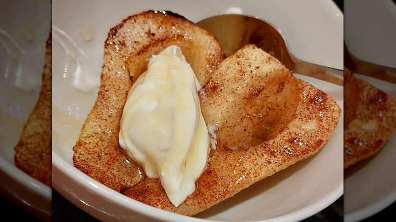 A bowl of air-fried pears with yogurt and honey