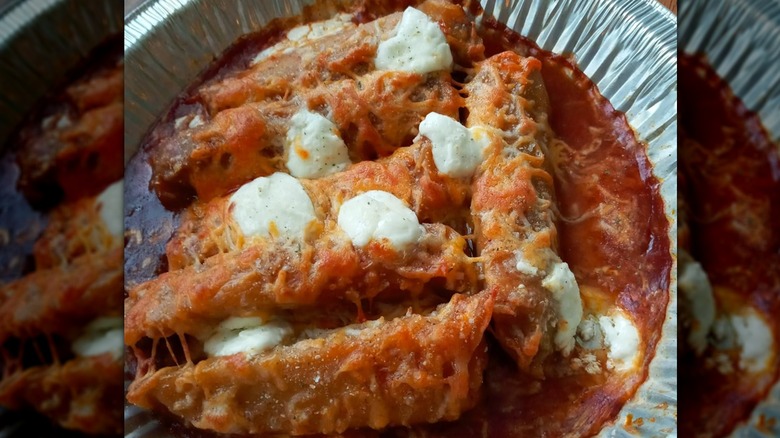 A foil dish of tamales cooked in an air fryer