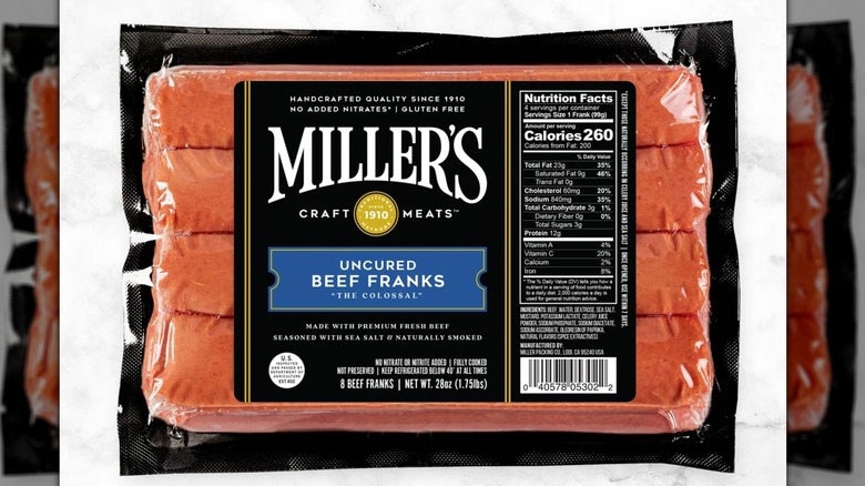 A pack of Miller's Beef Franks "The Colossal" on a white background