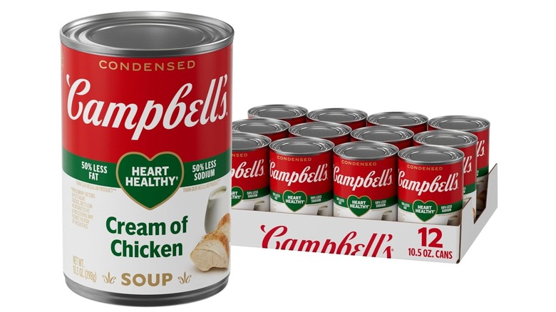 Several cans of Campbell's cream of chicken soup on a white background