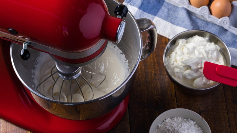 overhead view of kitchenaid stand mixer with cream