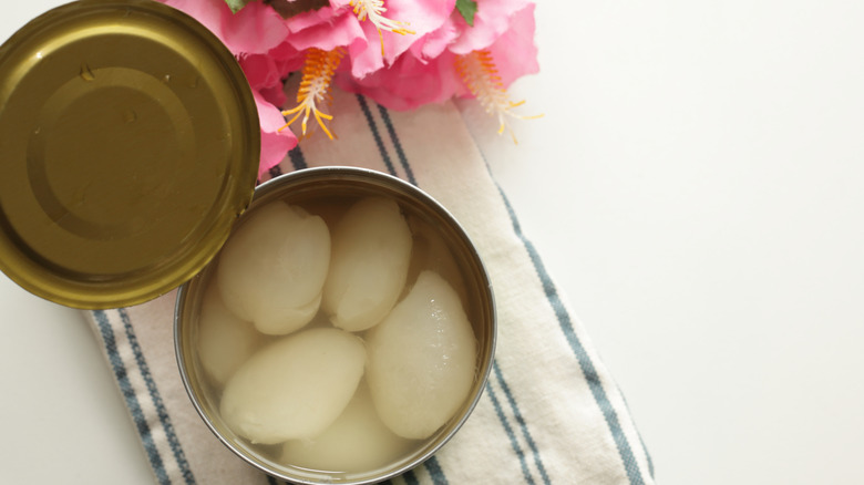 Tropical fruit rambutan in a tin can