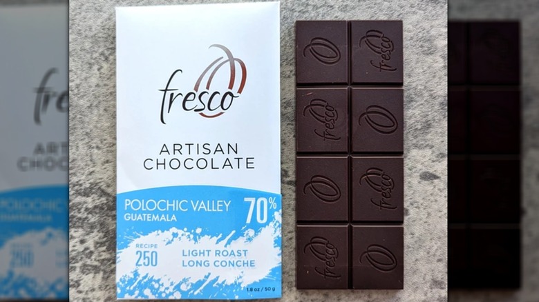 Two bars of Fresco's Guatemala Polochic Valley 70% chocolate, one without a wrapper