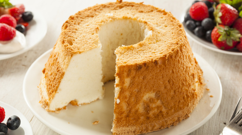 Inverted angel food cake with a slice removed