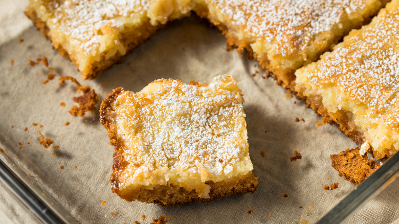 Homemade gooey butter cake with powdered sugar