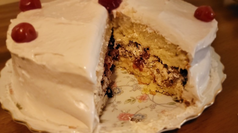A close-up of a cut Lady Baltimore cake