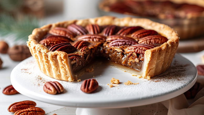 A sliced open pecan pie