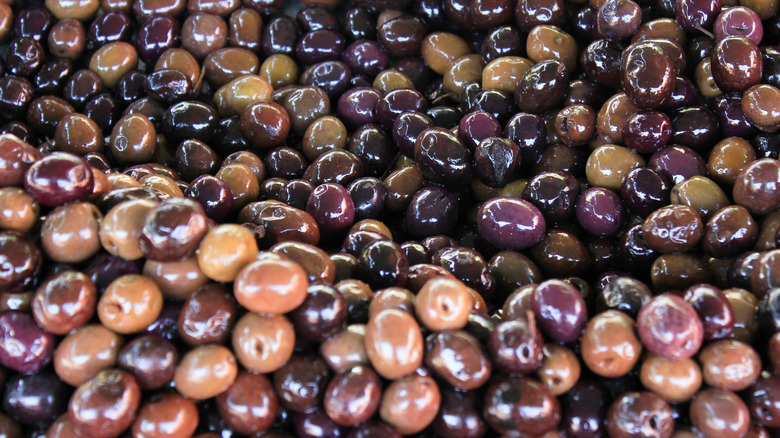 Stall with Amfissa olives at street market in Athens, Greece
