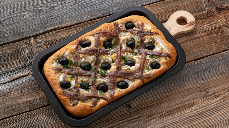 Pissaladière is the famous French onion pie. This onion "pizza" with anchovies and olives comes from Nice and can be made with bread or cooked dough