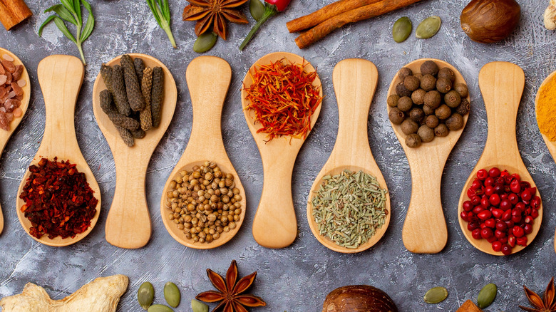 A set of spices on a gray background