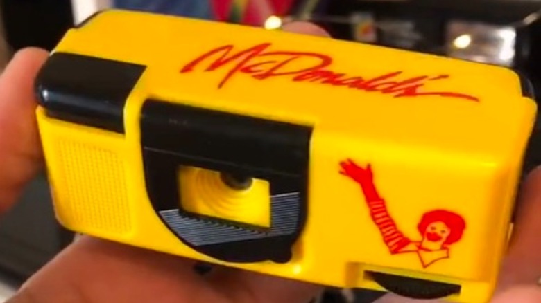 A close-up of a McDonald's 110 film camera