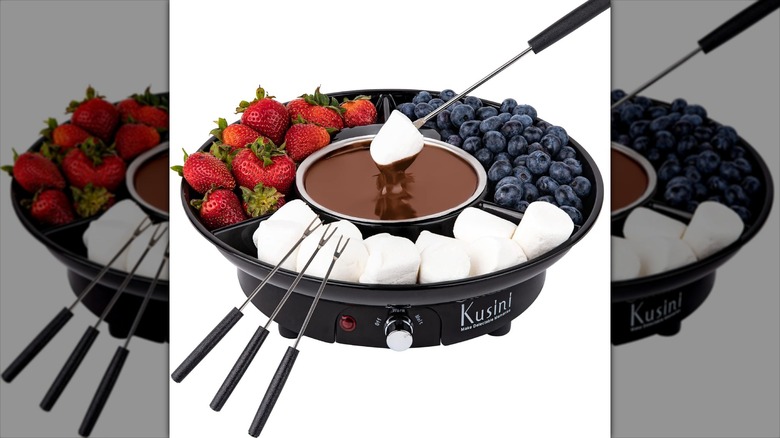 electric fondue pot with fruit and marshmallows
