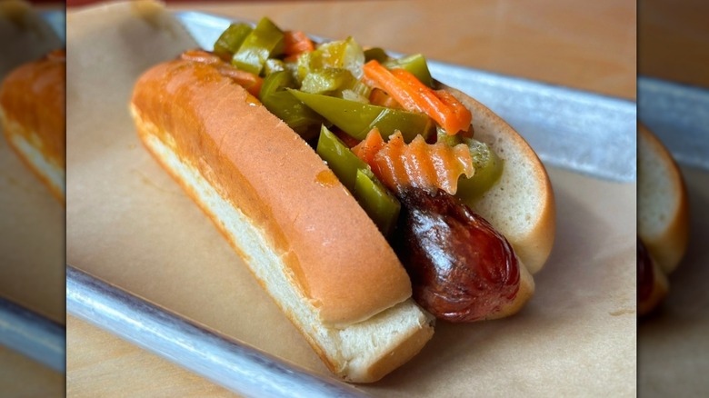 Close-up of a hot dog topped with giardiniera