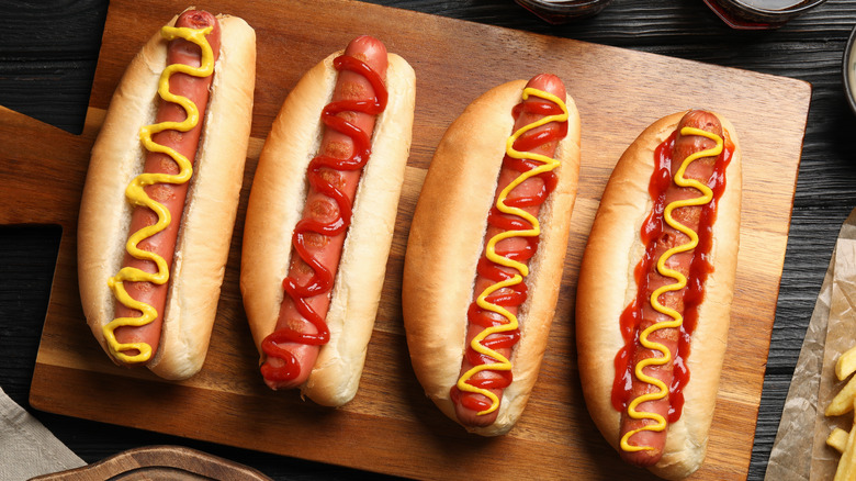 Four classic hot dogs, topped with ketchup and mustard
