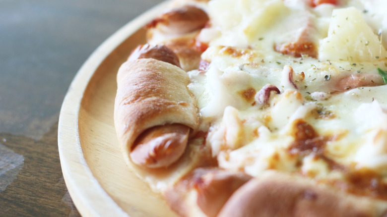 Hot dogs wrapped in pizza dough