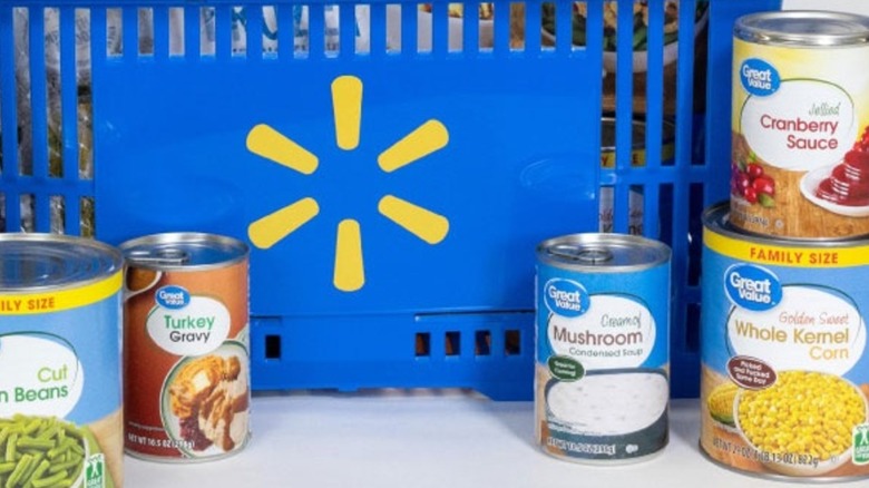 A Walmart shopping basket surrounded by Great Value range cans