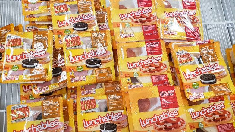 miscellaneous lunchables line a cold case