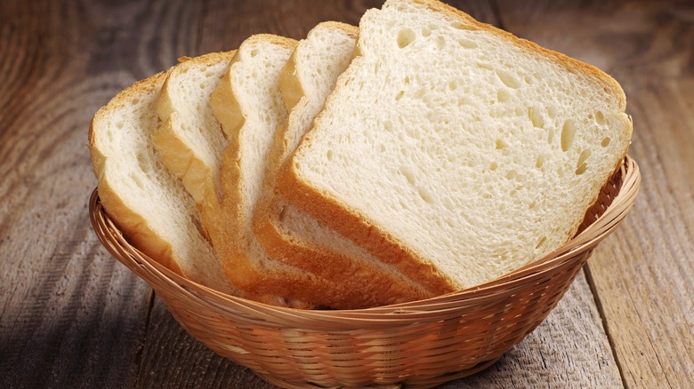 sliced of enriched white bread in a basket