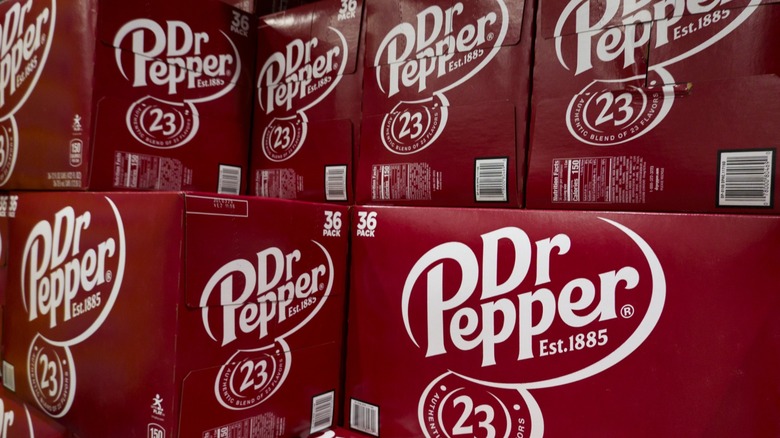 stacked cases of dr. pepper soda