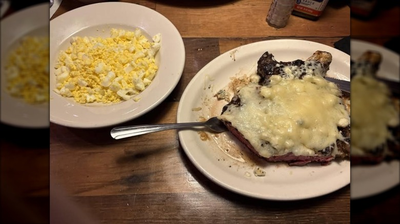 steak covered in cheese at texas roadhouse