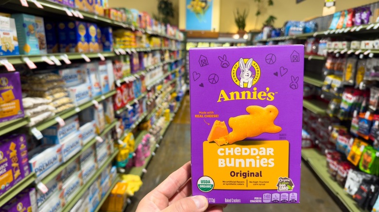 hand holds box of annie's cheddar bunnies