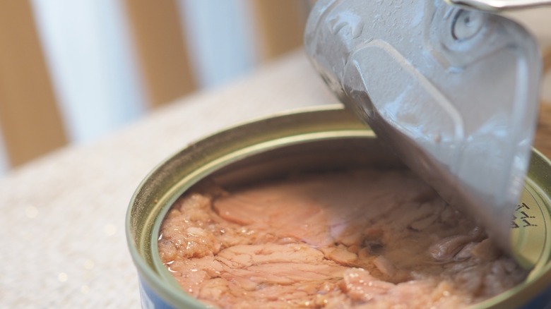 open can of tuna on table