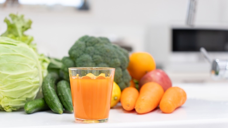 vegetable juice with veggies on counter