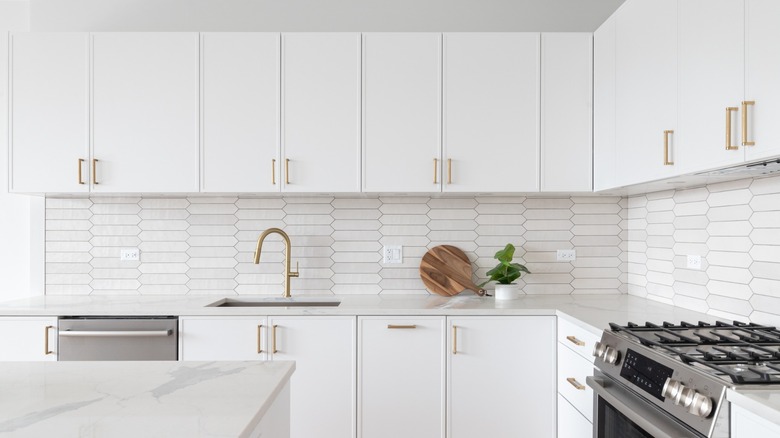 classic white kitchen with gold fixtures