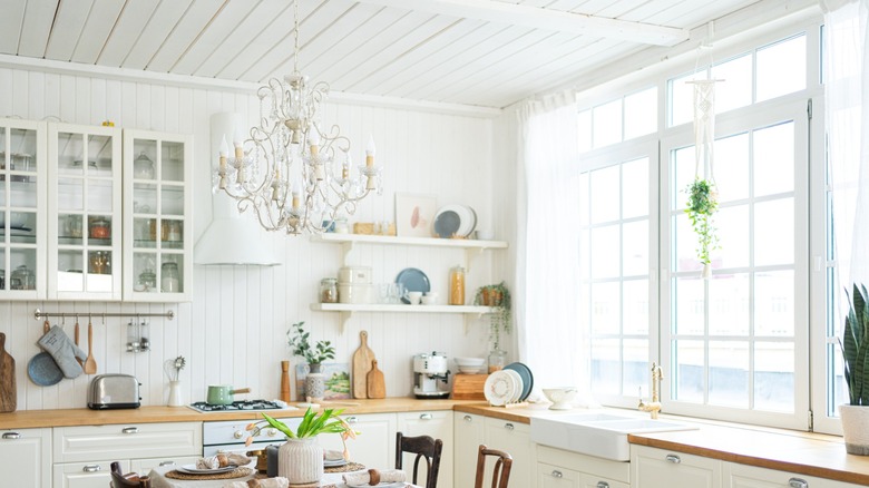 nordic kitchen with paneling and ivory cabinets