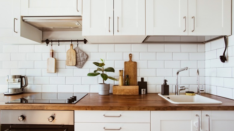all white kitchen with pretty cabinets