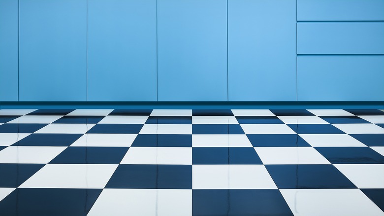 checkerboard kitchen floor with blue cabinets