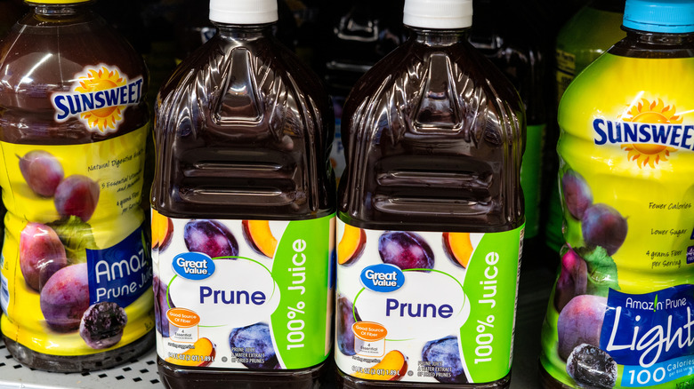 Bottles of prune juice on a store shelf