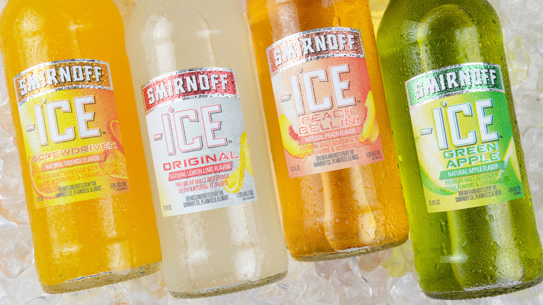 Four bottles of Smirnoff Ice on ice