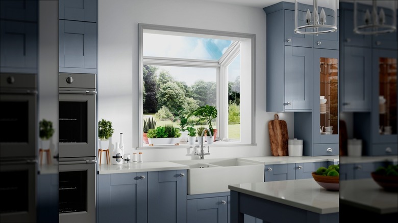 modern garden window with blue cabinets