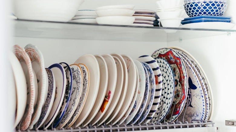 a rack of miscellaneous dishes on a shelf