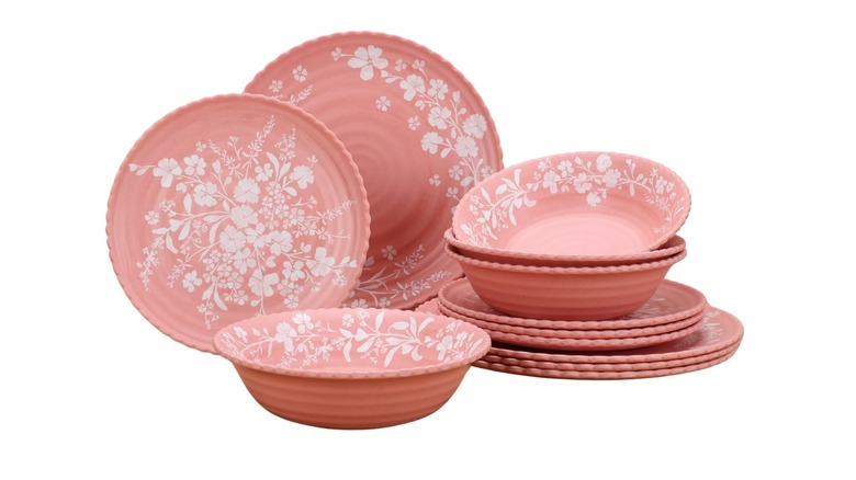 pink floral dishes on white background
