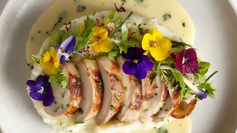 Chicken with edible pansies